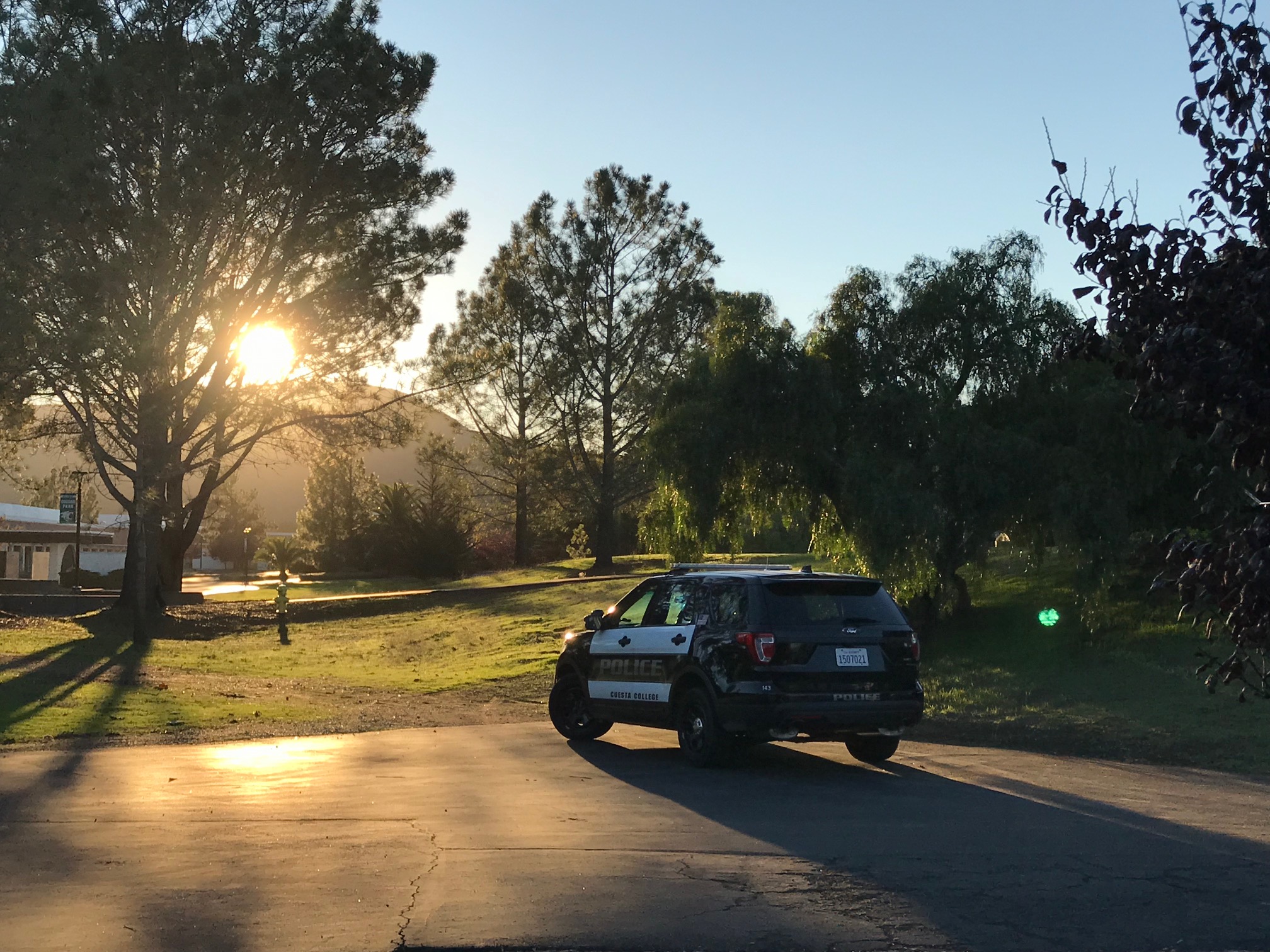 Cop car at sunset